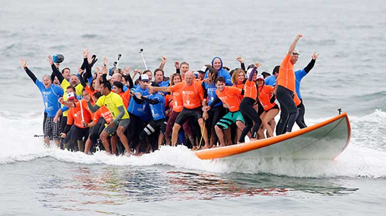 The Most People on a Surfboard